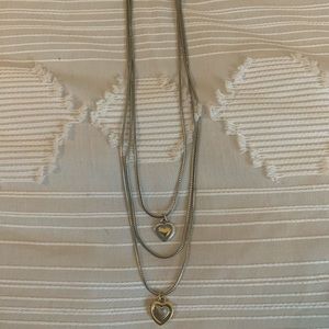 Brighton three layer necklace with two heart charms in silver and gold.